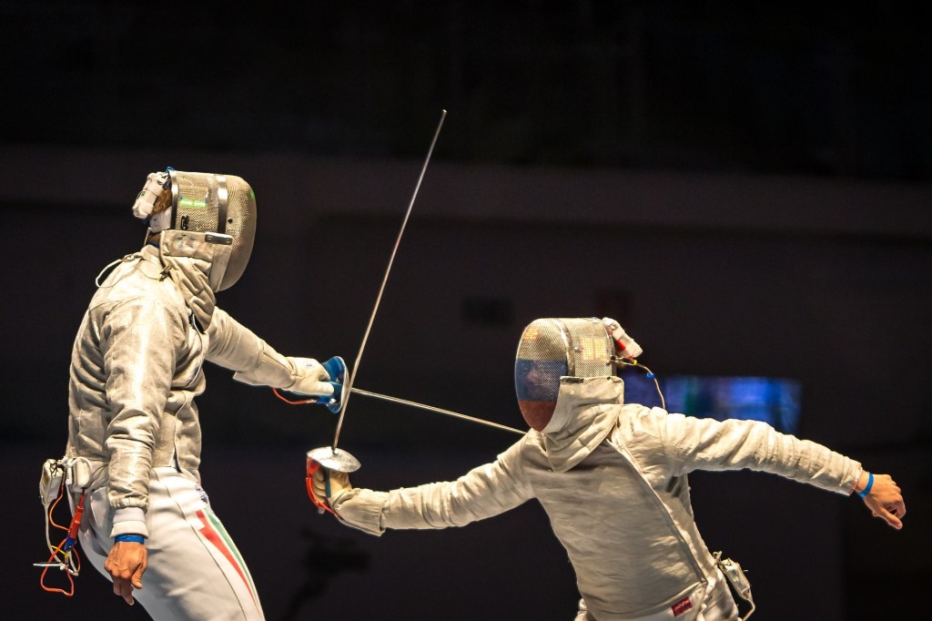 Two people fencing